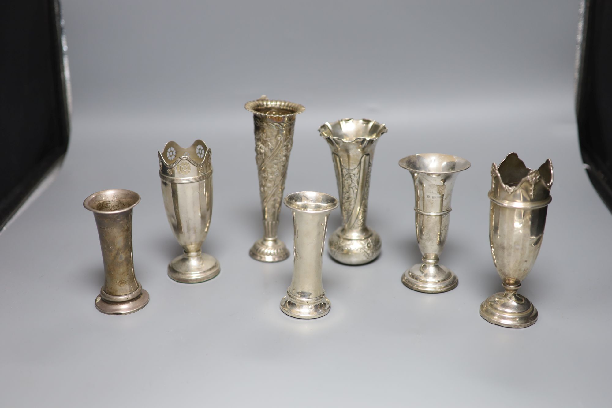 Seven assorted Victorian and later silver posy vases, largest 16.5cm, all weighted.